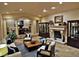 Spacious living area with tile flooring, fireplace, and decorative accents at 5030 Spanish Hills Dr, Las Vegas, NV 89148