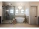 Luxurious bathroom featuring a freestanding tub, glass enclosed shower, and elegant gold fixtures at 516 Pinnacle Heights Ln, Las Vegas, NV 89144