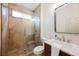 Bathroom featuring a walk-in shower with glass doors, marble countertops and gold fixtures at 516 Pinnacle Heights Ln, Las Vegas, NV 89144