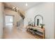 Inviting foyer with staircase, hardwood floors, stylish console table, decor and elegant chandelier at 516 Pinnacle Heights Ln, Las Vegas, NV 89144