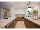 Bright kitchen featuring island, white cabinets and stainless steel appliances at 516 Pinnacle Heights Ln, Las Vegas, NV 89144