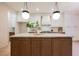 Kitchen featuring island, white cabinets and stainless steel appliances at 516 Pinnacle Heights Ln, Las Vegas, NV 89144