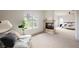 Bright main bedroom featuring a fireplace, seating area, and ample natural light at 516 Pinnacle Heights Ln, Las Vegas, NV 89144