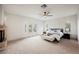 Spacious main bedroom with a fireplace, large windows, and plush carpeting at 516 Pinnacle Heights Ln, Las Vegas, NV 89144
