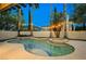 Beautiful backyard pool with outdoor lighting and tall palm trees for privacy and relaxation at 516 Pinnacle Heights Ln, Las Vegas, NV 89144