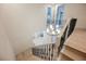 Bright, modern staircase features light wood treads, decorative iron railings, and a stylish chandelier at 516 Pinnacle Heights Ln, Las Vegas, NV 89144