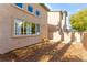 Private backyard with low maintenance landscaping and a small patio area at 5615 Calais Ct, Las Vegas, NV 89118