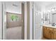 Neutral bedroom with tan walls, carpet, and access to the bathroom at 5615 Calais Ct, Las Vegas, NV 89118