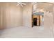Spacious living room with vaulted ceilings, a ceiling fan, and an open view of the kitchen at 5615 Calais Ct, Las Vegas, NV 89118