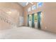 Spacious living room with vaulted ceilings, windows, a staircase, and a ceiling fan at 5615 Calais Ct, Las Vegas, NV 89118