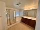Bathroom featuring tile flooring, shower, soaking tub, and double sinks at 5653 Mount Athos St, North Las Vegas, NV 89031