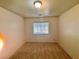 Bedroom with carpet flooring, blind window and white walls at 5653 Mount Athos St, North Las Vegas, NV 89031