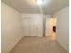 Bedroom with carpet flooring, closet and white walls at 5653 Mount Athos St, North Las Vegas, NV 89031