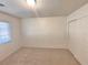 Bedroom with carpet flooring, closet and white walls at 5653 Mount Athos St, North Las Vegas, NV 89031