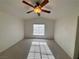 Bedroom featuring vaulted ceiling, ceiling fan, and natural light from the window at 5653 Mount Athos St, North Las Vegas, NV 89031