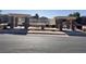 Community pool with tables and chairs under covered seating at 5653 Mount Athos St, North Las Vegas, NV 89031