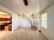 Inviting entryway with staircase, view of kitchen, and natural light at 5653 Mount Athos St, North Las Vegas, NV 89031