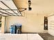 Well-lit two-car garage with storage shelves and utility connections at 5653 Mount Athos St, North Las Vegas, NV 89031