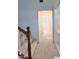 Upstairs hallway featuring carpet, natural light and access to rooms at 5653 Mount Athos St, North Las Vegas, NV 89031