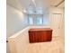Upstairs hallway with carpet, built in wood cabinet, and white walls at 5653 Mount Athos St, North Las Vegas, NV 89031