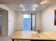Bright kitchen area with sliding door and recessed lighting at 5653 Mount Athos St, North Las Vegas, NV 89031