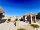 A relaxing pool area with pergola, barbecue, and lounge seating surrounded by mature landscaping at 5653 Mount Athos St, North Las Vegas, NV 89031