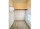 Carpeted walk-in closet provides ample space for clothing and accessory storage at 5653 Mount Athos St, North Las Vegas, NV 89031