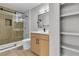 Modern bathroom featuring a glass shower, wood-look cabinets, and a marble-look shower at 5710 E Tropicana Ave # 2152, Las Vegas, NV 89122