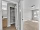 Well-lit bedroom showcasing a walk-in closet and en-suite bathroom, blending comfort and convenience at 5710 E Tropicana Ave # 2152, Las Vegas, NV 89122