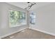 A bright bedroom with large windows, providing ample natural light and views of the surrounding greenery at 5710 E Tropicana Ave # 2152, Las Vegas, NV 89122