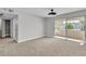 Bright primary bedroom with sliding glass doors leading to a balcony, offering a peaceful retreat at 5710 E Tropicana Ave # 2152, Las Vegas, NV 89122