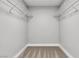 Walk in closet featuring shelving, neutral colors, and carpeted floor at 5710 E Tropicana Ave # 2152, Las Vegas, NV 89122