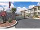 Gated community entrance with stone signage and lush landscaping, ensuring security and privacy at 5710 E Tropicana Ave # 2152, Las Vegas, NV 89122
