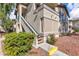 Charming two-story condo building featuring well-maintained landscaping and inviting stairs at 5710 E Tropicana Ave # 2152, Las Vegas, NV 89122