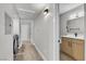 Bright hallway featuring a bathroom, washer and dryer, and a neutral color scheme at 5710 E Tropicana Ave # 2152, Las Vegas, NV 89122