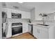 Modern kitchen with white cabinets, stainless steel appliances, and quartz countertops at 5710 E Tropicana Ave # 2152, Las Vegas, NV 89122