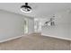 Spacious living room featuring neutral carpet and a seamless flow to the kitchen, ideal for entertaining at 5710 E Tropicana Ave # 2152, Las Vegas, NV 89122
