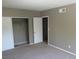 Carpeted bedroom with closet, providing ample storage space at 574 Roxella Ln # C, Las Vegas, NV 89110
