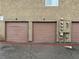 Exterior image showcasing assigned garages, each with a separate door and assigned number at 574 Roxella Ln # C, Las Vegas, NV 89110