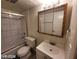 Bathroom with a shower, tub, toilet, and vanity mirror above the sink at 615 S Royal Crest Cir # 10, Las Vegas, NV 89169