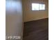 Bedroom with hardwood flooring and a large window letting in lots of natural light at 615 S Royal Crest Cir # 10, Las Vegas, NV 89169