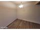 A view of a dining room with wood floors and a modern light fixture at 615 S Royal Crest Cir # 10, Las Vegas, NV 89169