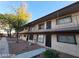 Apartment building exterior with desert landscaping, walkway, and covered balconies at 615 S Royal Crest Cir # 10, Las Vegas, NV 89169