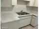 A close up view of a double sink in a kitchen with white countertops at 615 S Royal Crest Cir # 10, Las Vegas, NV 89169
