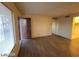 View of an open, airy living room with wooden floors and lots of light at 615 S Royal Crest Cir # 10, Las Vegas, NV 89169
