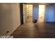 Spacious living room with hardwood flooring, closet, and an ensuite bathroom with a shower over bath at 615 S Royal Crest Cir # 10, Las Vegas, NV 89169