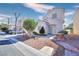 Lovely home with a cozy front entrance and manicured landscaping for enhanced curb appeal at 6233 Overhang Ave, Henderson, NV 89011