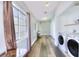 Spacious laundry room equipped with modern washer and dryer units, and ample storage space at 6233 Overhang Ave, Henderson, NV 89011