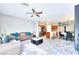 Open-concept layout features a living room seamlessly connected to a kitchen with a dining area at 6233 Overhang Ave, Henderson, NV 89011
