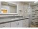 Modern bathroom showcasing a sleek vanity, glass-enclosed shower with stylish tile work, and updated fixtures at 633 5Th St, Boulder City, NV 89005